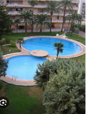 Acogedor apartamento en Daimús a 200 metros de la playa con parking privado y piscinas comunitarias